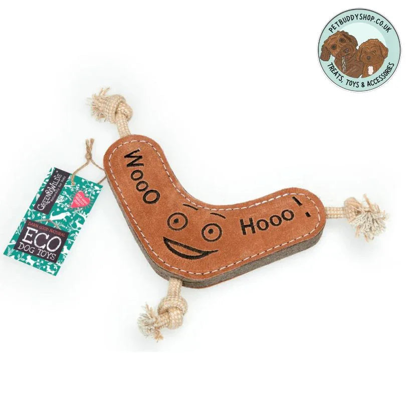 Brown boomerang shaped dog toy with the words "woo hoo" sewn into it in black stitching as well as a smiley face. Dog toy is against a white background featuring the PetBuddy brand logo in the top right hand corner.