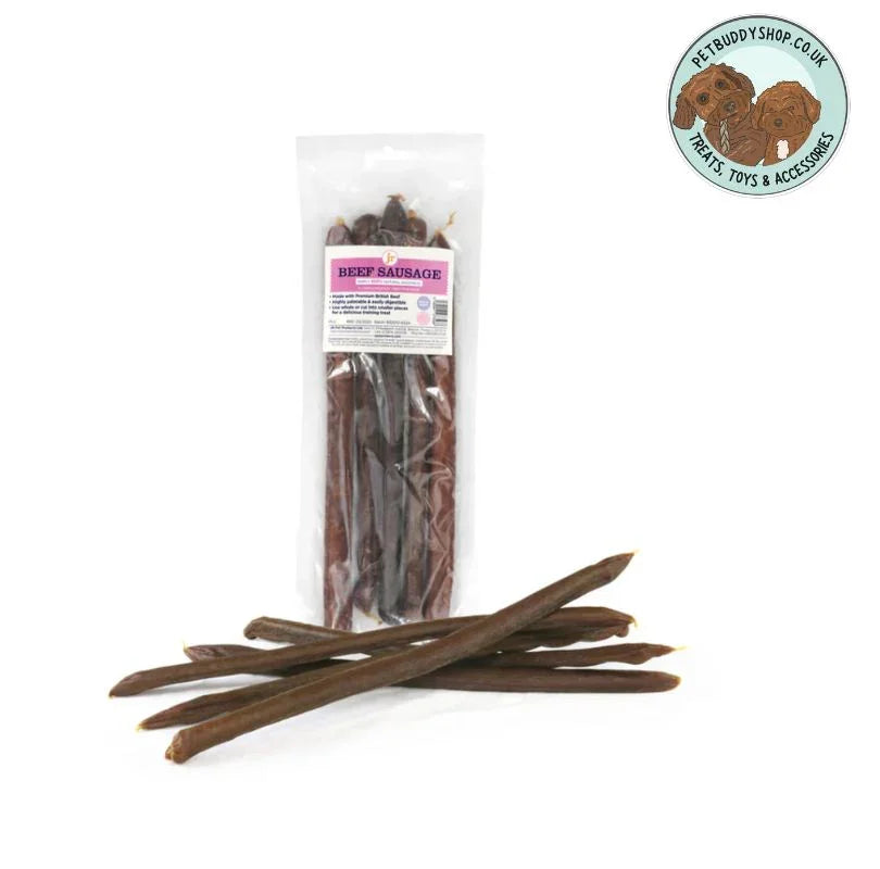 Whole Beef Sausages dog treats in a transparent packet with 4 sausages laying flat outside the pack on a white background.
