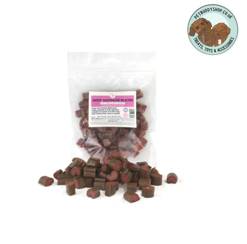 Sliced up Beef Sausages dog treats in a transparent packet with slices of sausages laying flat outside the pack on a white background.