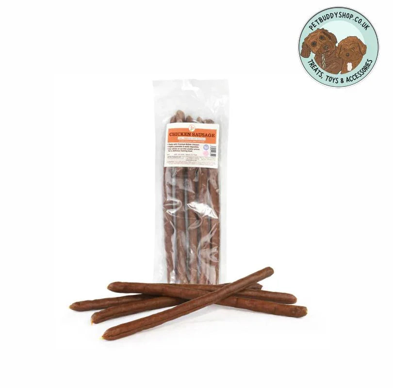 Whole Chicken Sausages dog treats in a transparent packet with 4 sausages laying flat outside the pack on a white background.
