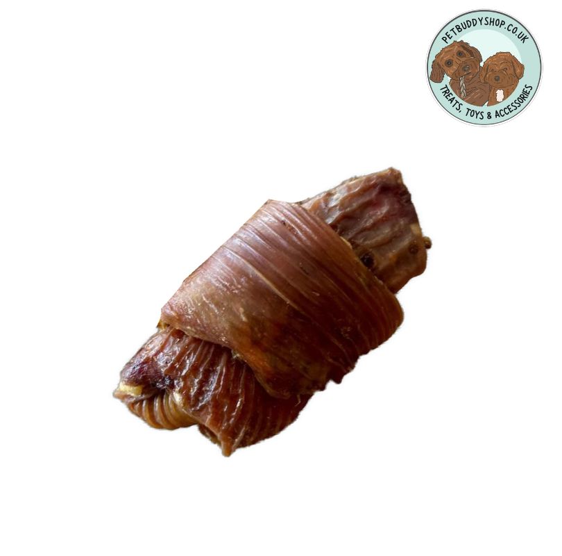 Brown croissant shaped natural dog treat on a white background with the PetBuddy logo in the top right hand corner.